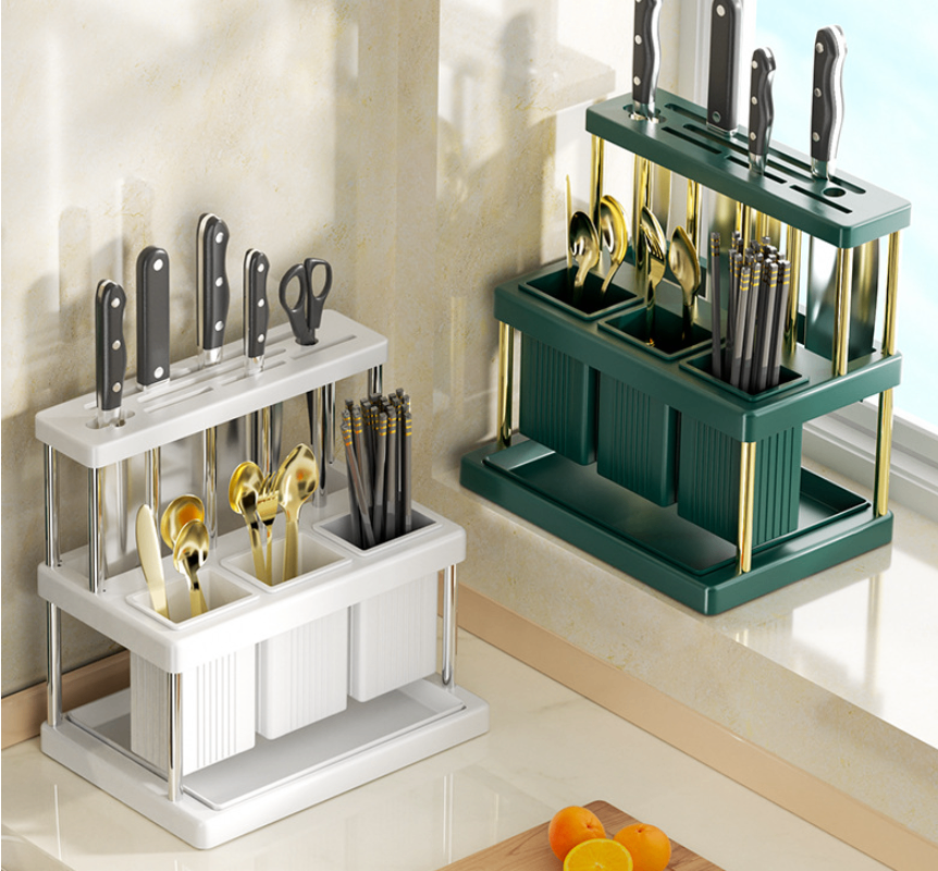 White and green kitchen utensil organizers displayed on a countertop