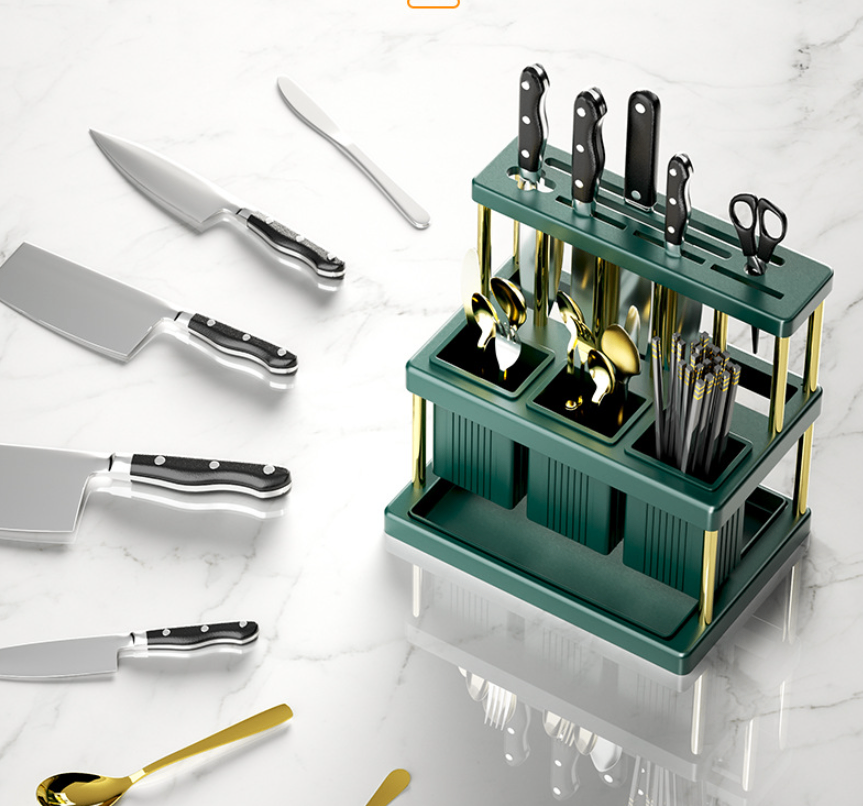 Green kitchen utensil organizer shown with gold accents and example kitchen tools