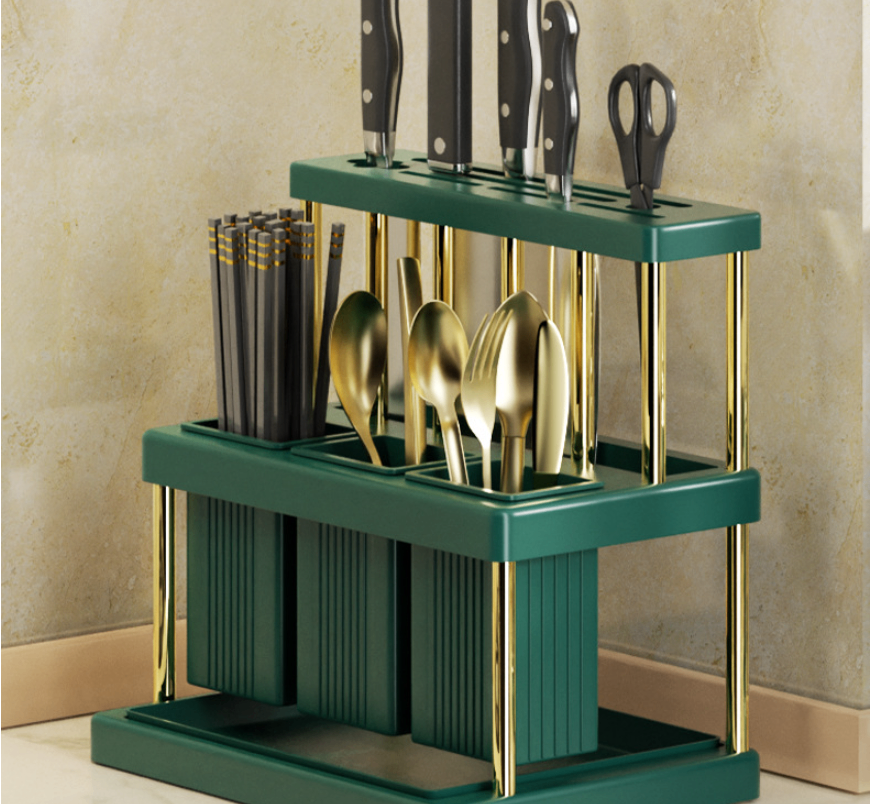 Front view of green countertop utensil organizer with separate storage compartments